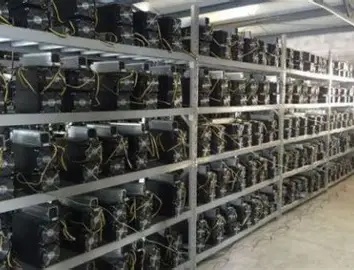 A mining farm showing rows of mining rigs. 