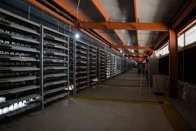 A bustling mining farm hosting multiple Goldshell ASIC rigs for optimal Bitcoin and Ethereum mining
